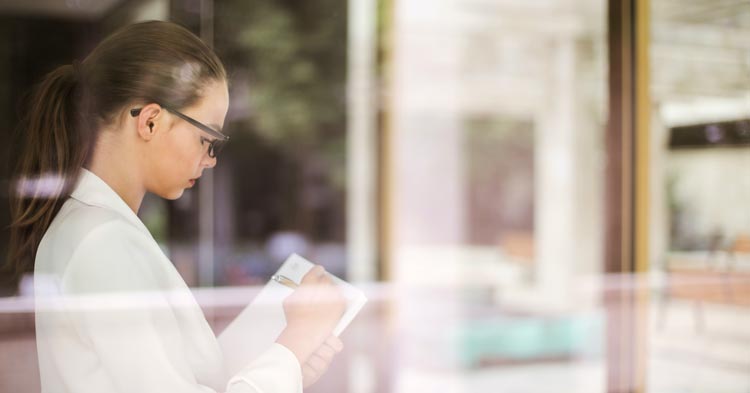 employer writing on tablet seeking an employment attorney to research after-acquired evidence