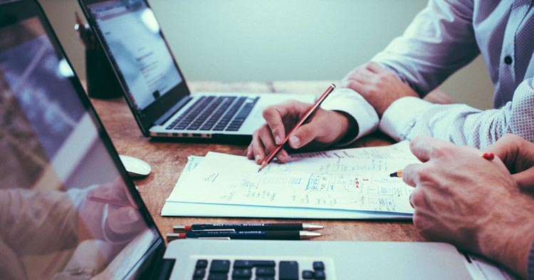 businessmen figuring out the alternate valuation date for federal estate tax purposes