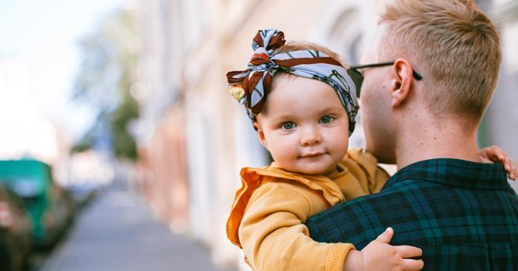 father carrying a baby child support
